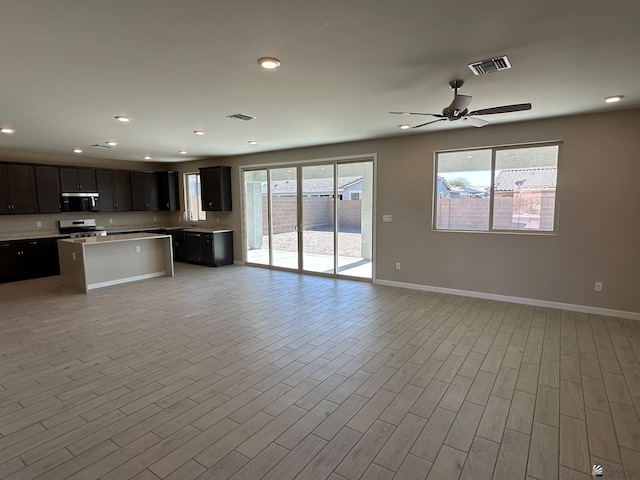 14701 E 42nd St, Yuma, AZ 85367 - kitchen featuring open floor plan, appliances with stainless steel finishes, baseboards, and visible vents