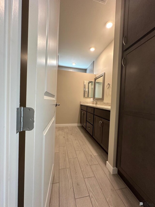 14701 E 42nd St, Yuma, AZ 85367 - full bathroom with vanity, wood tiled floors, and recessed lighting