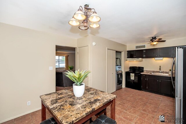 1878 S Meadowbrook Ave, Yuma, AZ 85364 - kitchen featuring electric range, a sink, freestanding refrigerator, washer / dryer, and under cabinet range hood