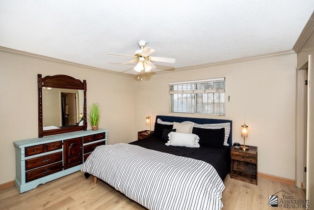 1878 S Meadowbrook Ave, Yuma, AZ 85364 - bedroom featuring ornamental molding, light wood finished floors, baseboards, and a ceiling fan