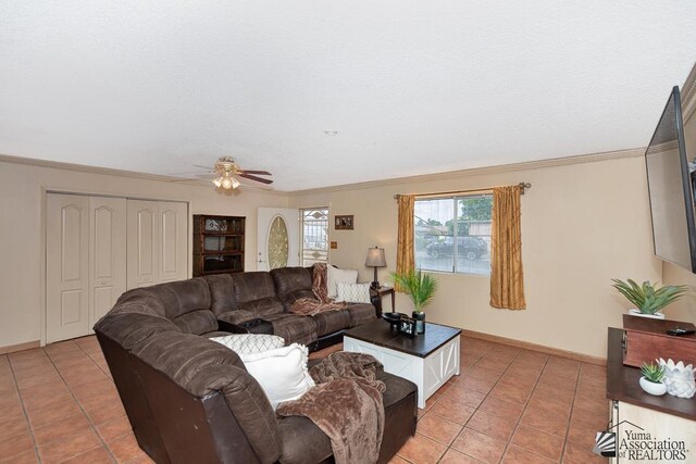 1878 S Meadowbrook Ave, Yuma, AZ 85364 - living room with light tile patterned floors, ceiling fan, crown molding, and baseboards