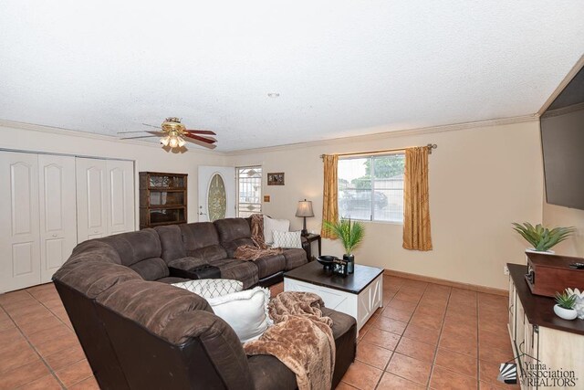 1878 S Meadowbrook Ave, Yuma, AZ 85364 - living room featuring light tile patterned floors, a ceiling fan, crown molding, a textured ceiling, and baseboards