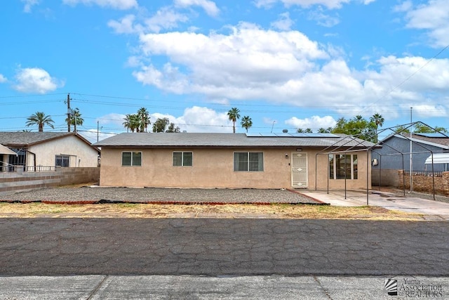 1878 S Meadowbrook Ave, Yuma, AZ 85364 - ranch-style home with stucco siding, solar panels, and fence