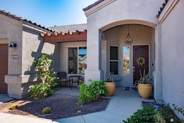 8221 E 35th Ln, Yuma, AZ 85365 - doorway to property with stucco siding and a tiled roof