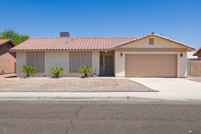 11250 E 25th Pl, Yuma, AZ 85367 - view of front of property with stucco siding, concrete driveway, a garage, and a tile roof