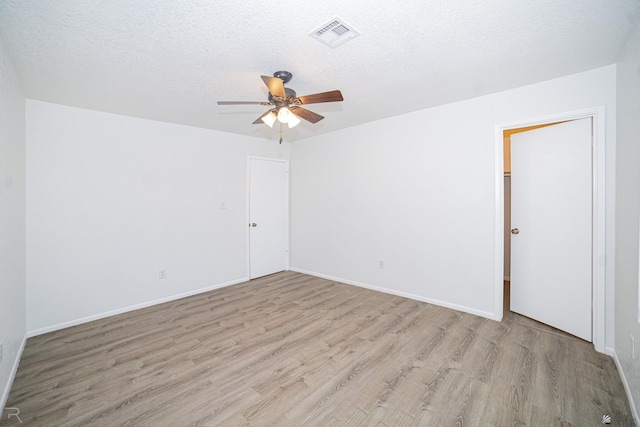 11250 E 25th Pl, Yuma, AZ 85367 - empty room featuring light wood finished floors, a ceiling fan, a textured ceiling, and baseboards