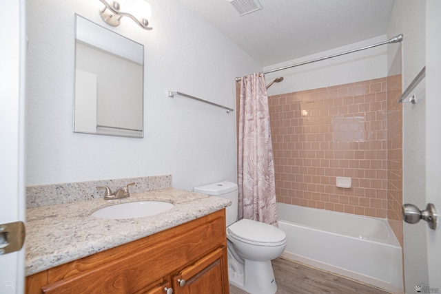 11250 E 25th Pl, Yuma, AZ 85367 - full bathroom with toilet, vanity, shower / bath combo with shower curtain, and wood finished floors