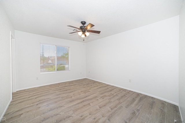 11250 E 25th Pl, Yuma, AZ 85367 - unfurnished room featuring light wood-type flooring, a ceiling fan, and baseboards