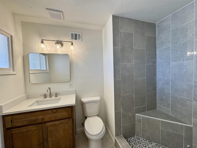 2039 S 11th Ave, Yuma, AZ 85364 - bathroom featuring vanity, toilet, and a tile shower