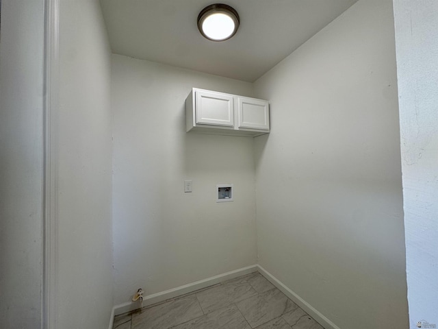 2039 S 11th Ave, Yuma, AZ 85364 - washroom with baseboards, washer hookup, cabinet space, and light marble finish floors