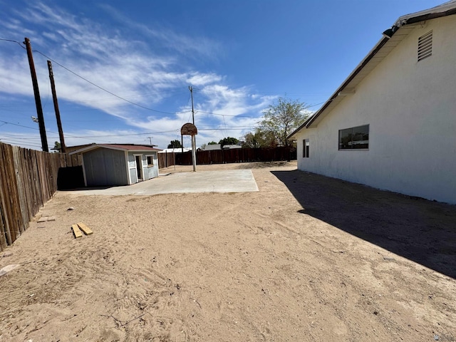 2039 S 11th Ave, Yuma, AZ 85364 - fenced backyard with a patio area and an outdoor structure