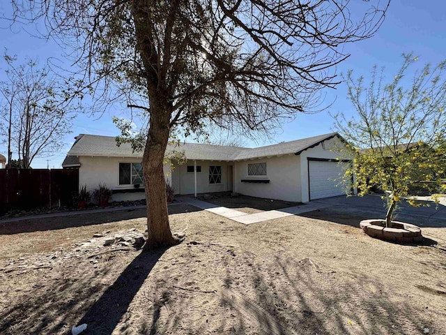 2039 S 11th Ave, Yuma, AZ 85364 - ranch-style home featuring driveway, a garage, and stucco siding