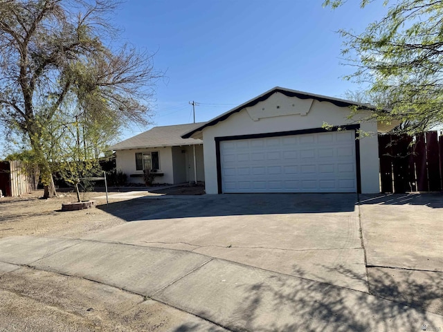 2039 S 11th Ave, Yuma, AZ 85364 - ranch-style home with stucco siding, concrete driveway, and a garage