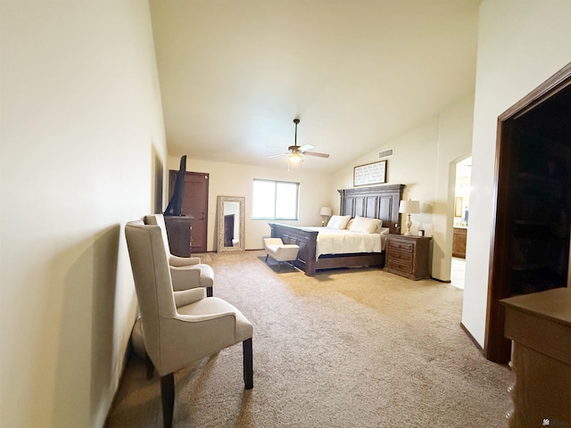 bedroom featuring light carpet, lofted ceiling, visible vents, and ceiling fan