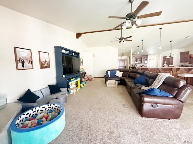 living area with lofted ceiling, ceiling fan, and carpet floors
