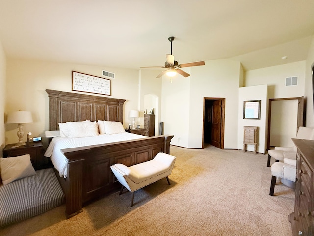 bedroom featuring light colored carpet, visible vents, and ceiling fan