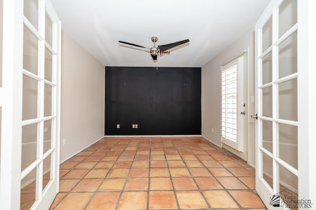 1508 W 14th St, Yuma, AZ 85364 - unfurnished room featuring ceiling fan, baseboards, and french doors