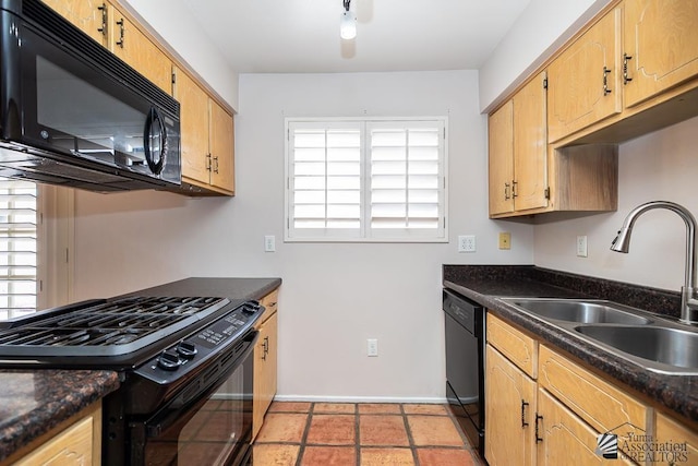 1508 W 14th St, Yuma, AZ 85364 - kitchen with black appliances, a sink, dark countertops, and baseboards