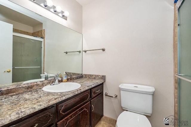 1508 W 14th St, Yuma, AZ 85364 - bathroom featuring vanity, a stall shower, and toilet