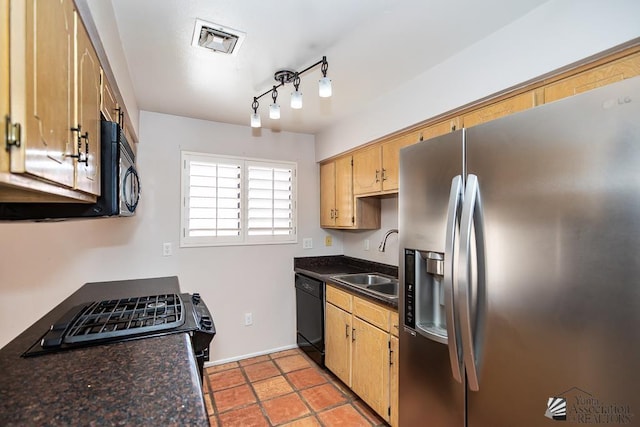 1508 W 14th St, Yuma, AZ 85364 - kitchen with black appliances, a sink, dark countertops, and track lighting