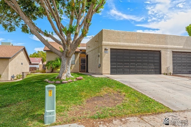 1508 W 14th St, Yuma, AZ 85364 - view of front of property with stucco siding, a front lawn, and concrete driveway