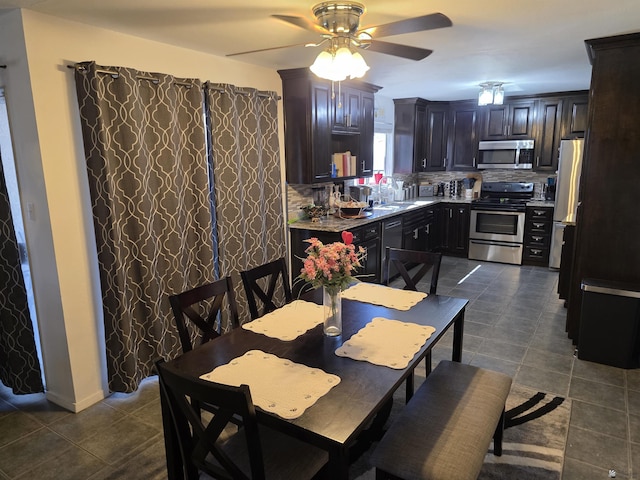 1904 E 26th Pl, Yuma, AZ 85365 - dining space featuring dark tile patterned floors and a ceiling fan