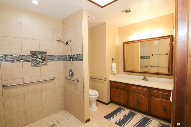 634 E 25th Pl, Yuma, AZ 85365 - bathroom with visible vents, vanity, toilet, tiled shower, and tile patterned floors