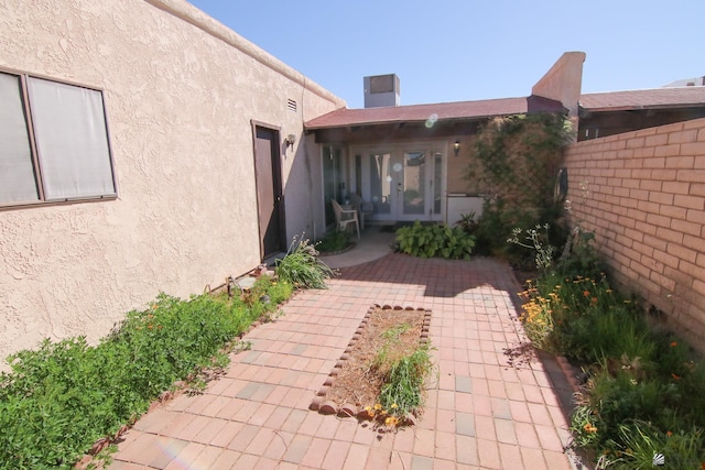 634 E 25th Pl, Yuma, AZ 85365 - back of property featuring fence, french doors, a patio area, and stucco siding