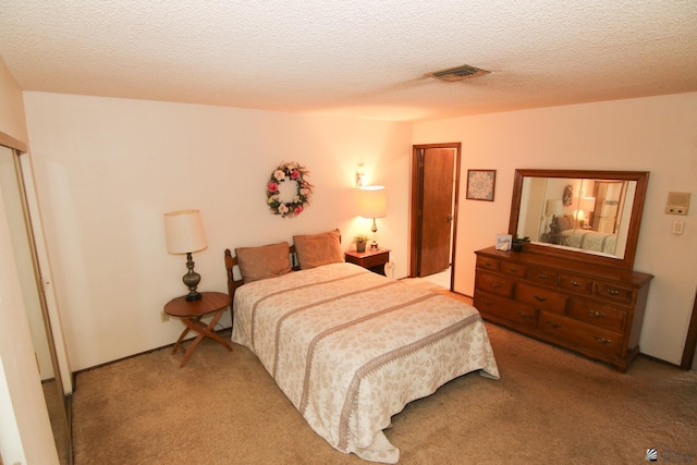 634 E 25th Pl, Yuma, AZ 85365 - bedroom with visible vents, a textured ceiling, and light colored carpet