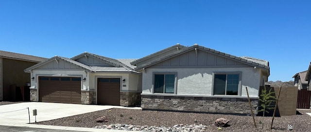 12320 S Aloa Ln, Yuma, AZ 85367 - craftsman inspired home featuring fence, an attached garage, stone siding, concrete driveway, and a tiled roof