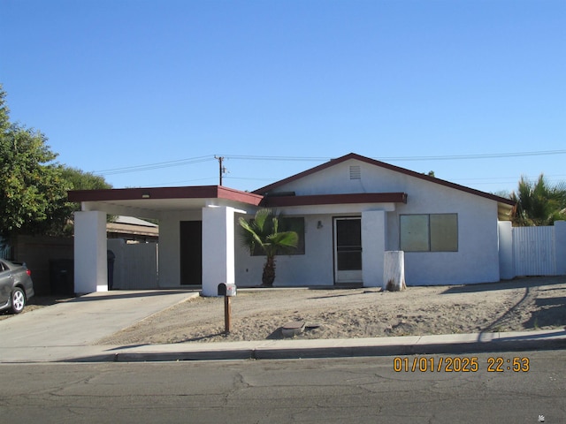 view of front facade with a carport