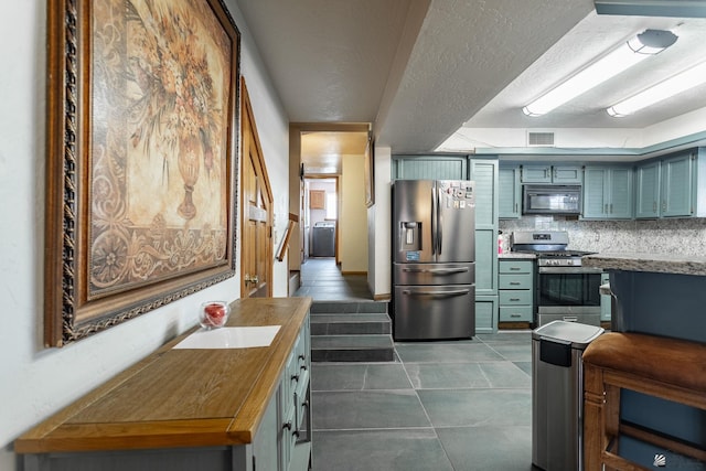 10538 S Del Vista Dr, Yuma, AZ 85367 - kitchen featuring stainless steel appliances, backsplash, wooden counters, a sink, and dark tile patterned flooring
