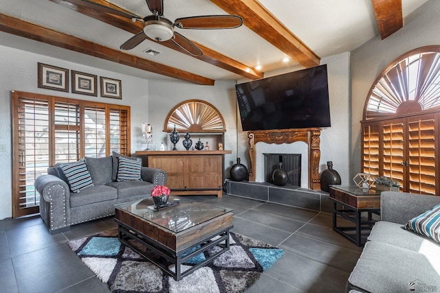 10538 S Del Vista Dr, Yuma, AZ 85367 - living area featuring beam ceiling, a ceiling fan, and a tiled fireplace