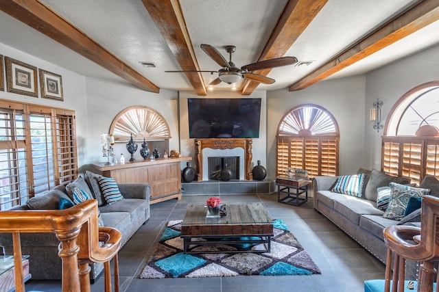 10538 S Del Vista Dr, Yuma, AZ 85367 - living room featuring a ceiling fan, beam ceiling, plenty of natural light, and tile patterned flooring