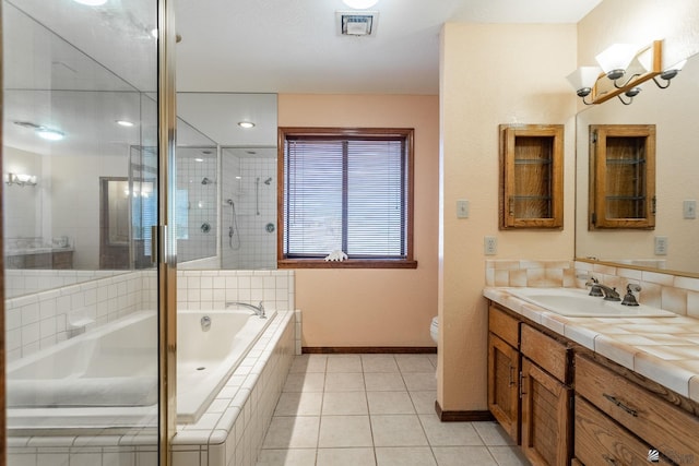 10538 S Del Vista Dr, Yuma, AZ 85367 - full bath featuring baseboards, tiled shower, a garden tub, toilet, and vanity