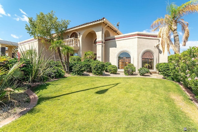 10538 S Del Vista Dr, Yuma, AZ 85367 - mediterranean / spanish-style home featuring stucco siding, a front yard, and a balcony