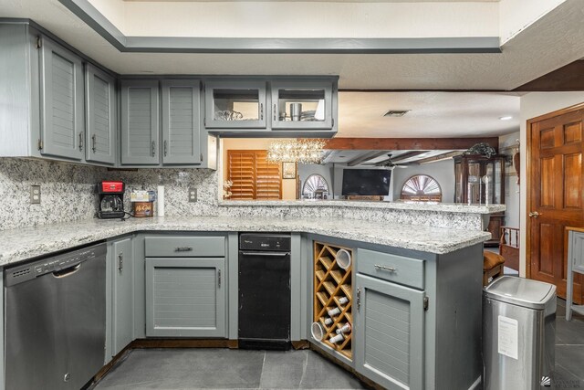 10538 S Del Vista Dr, Yuma, AZ 85367 - kitchen with stainless steel dishwasher, gray cabinetry, a peninsula, tasteful backsplash, and light stone counters