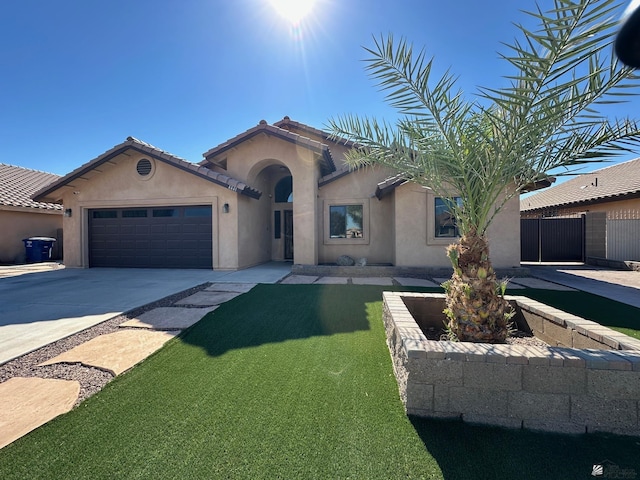 4441 W 13th St, Yuma, AZ 85364 - view of front facade with a front lawn, fence, stucco siding, an attached garage, and driveway