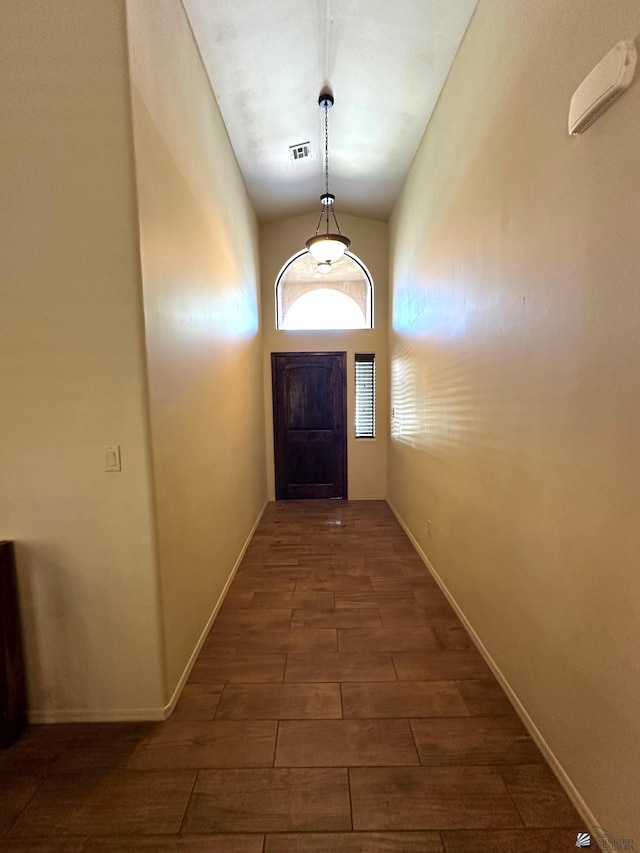 4441 W 13th St, Yuma, AZ 85364 - entryway featuring dark wood-style flooring, baseboards, visible vents, and vaulted ceiling