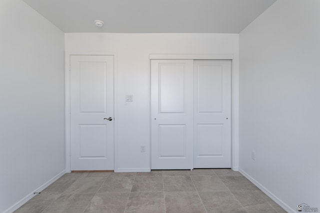10752 E 45th Pl, Yuma, AZ 85367 - unfurnished bedroom with baseboards and a closet