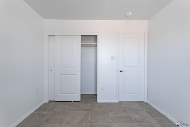 10752 E 45th Pl, Yuma, AZ 85367 - unfurnished bedroom with a closet and baseboards