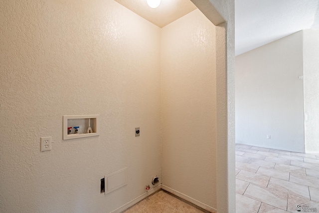 laundry area featuring washer hookup, gas dryer hookup, laundry area, electric dryer hookup, and a textured wall