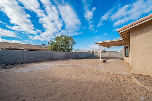 view of yard featuring a fenced backyard and a patio area