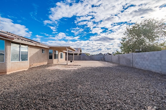 view of yard with a fenced backyard and a patio area