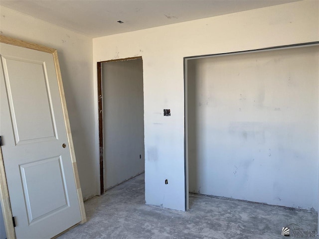 12649 W 51st Pl, Yuma, AZ 85367 - unfurnished bedroom with unfinished concrete flooring and a closet