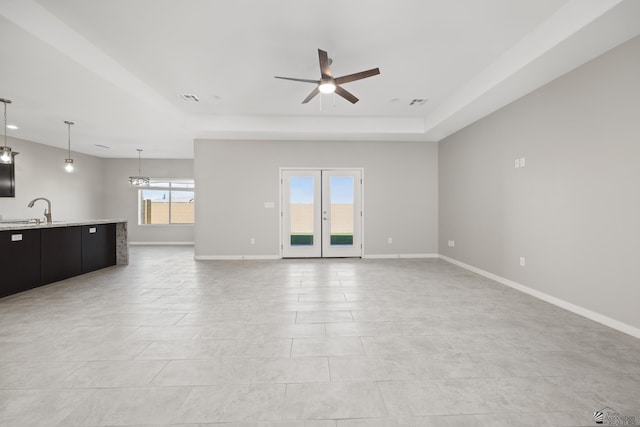 3562 S Sage Ave, Yuma, AZ 85365 - unfurnished living room featuring ceiling fan and a tray ceiling