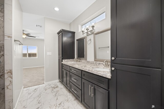 3562 S Sage Ave, Yuma, AZ 85365 - full bath with marble look tiles, double vanity, and ceiling fan