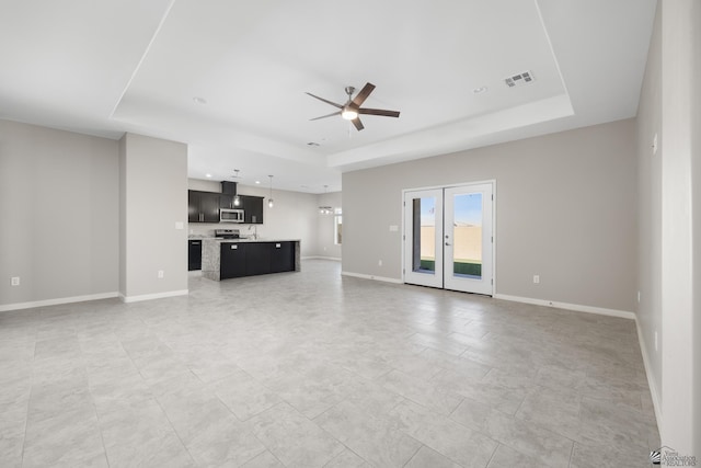 3562 S Sage Ave, Yuma, AZ 85365 - unfurnished living room with a raised ceiling, ceiling fan, french doors, and recessed lighting