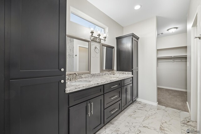 3562 S Sage Ave, Yuma, AZ 85365 - full bath with double vanity, marble look tile flooring, and a walk in closet