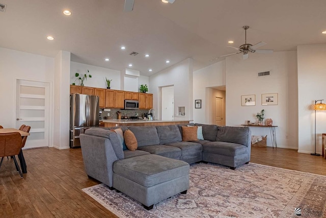11608 E 26th Ln, Yuma, AZ 85367 - living area with ceiling fan, wood finished floors, recessed lighting, built in shelves, and high vaulted ceiling